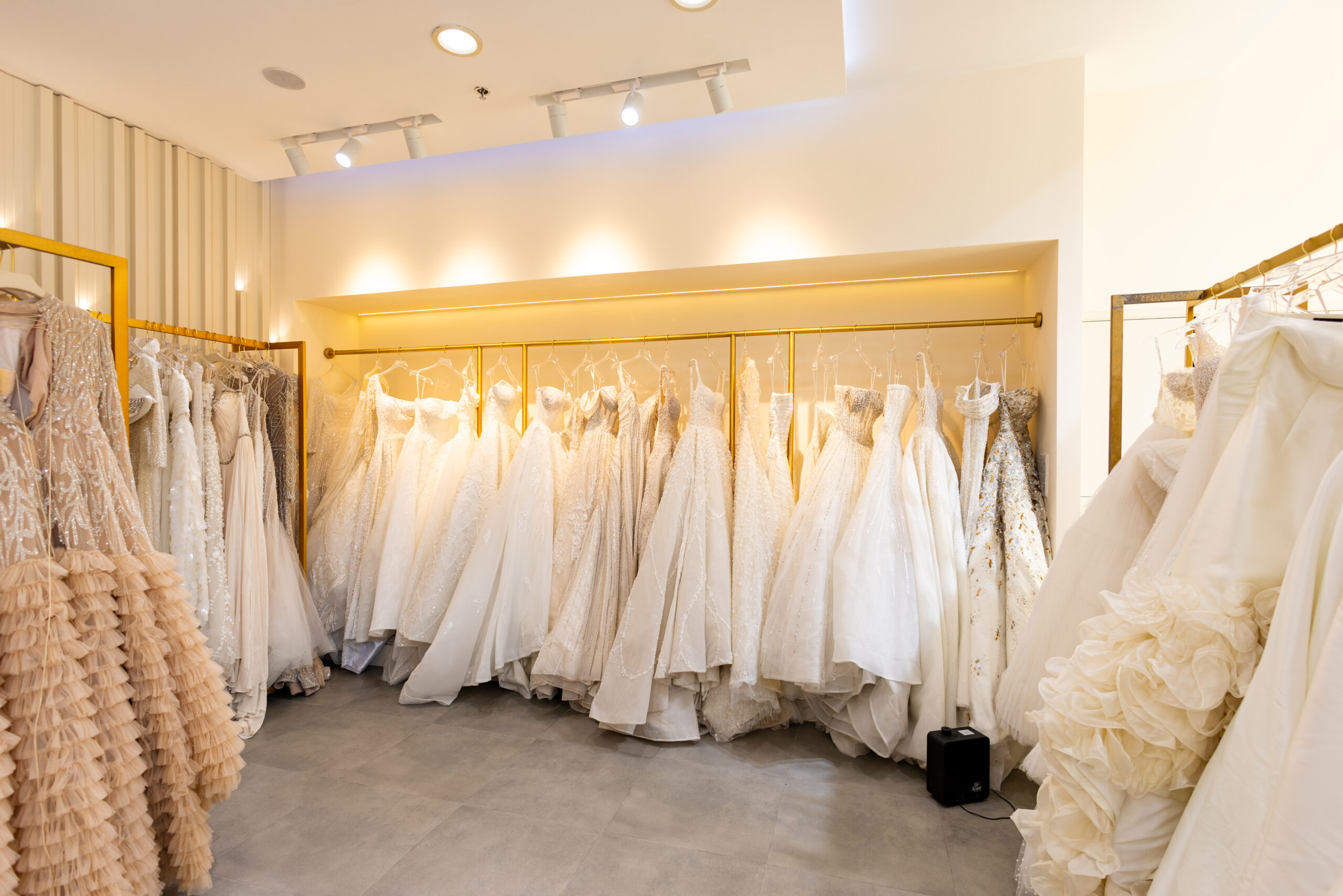 bridal gowns on a rail