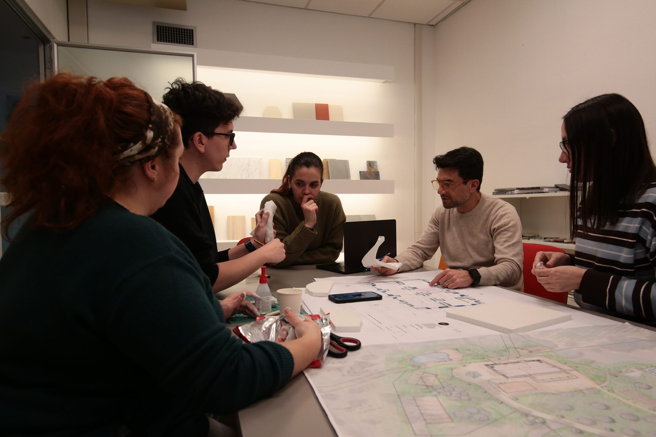 The RVA team working around a project table